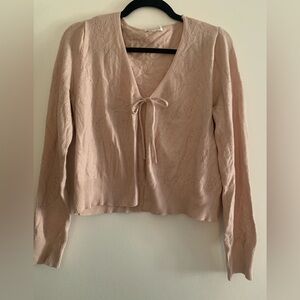Cream colored cardigan. Size large. Cute flower/butterfly detail